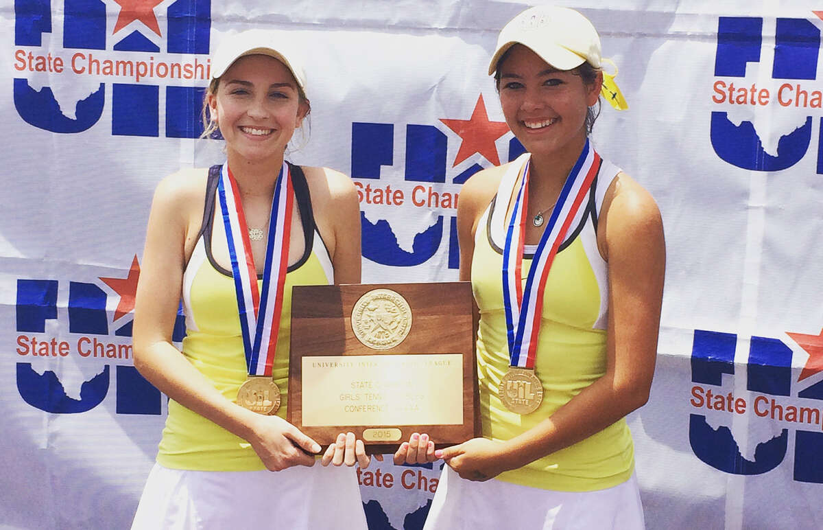 Alamo Heights’ Solene Crawley (left) and Brittney Wilbur pose with their trophy after winning the UIL Class 5A girls doubles title.