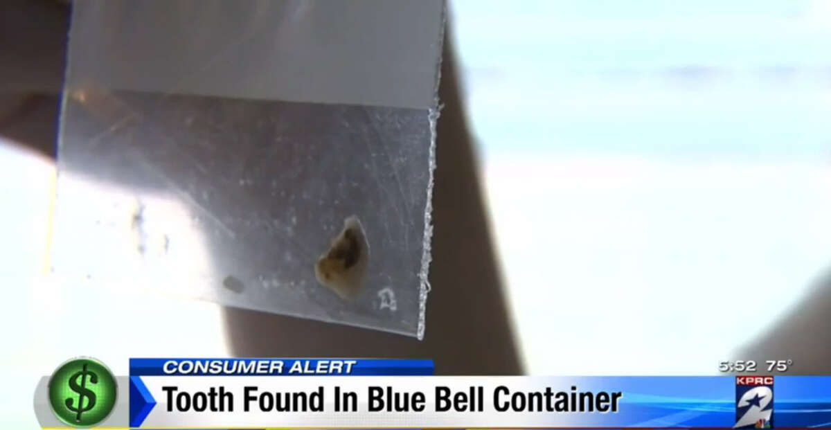 A Houston family claims they found this tooth inside a carton of Blue Bell Cookies 'n Cream ice cream in March.