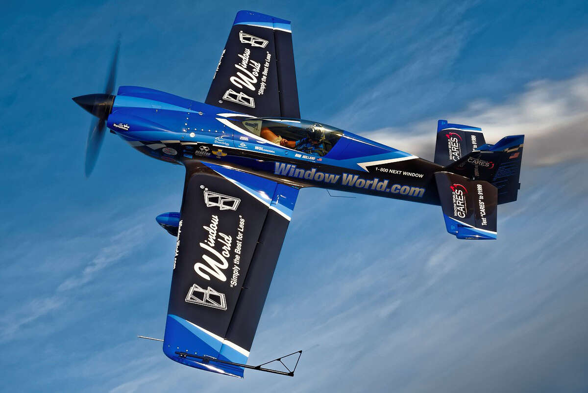Stunt pilot Rob Holland showing off the sponsorship logos for Window World. The window replacement company, which has a location in Manchester, is a sponsor of the Great New England Airshow, taking place May 16 & 17 in Chicopee, Massachusetts.