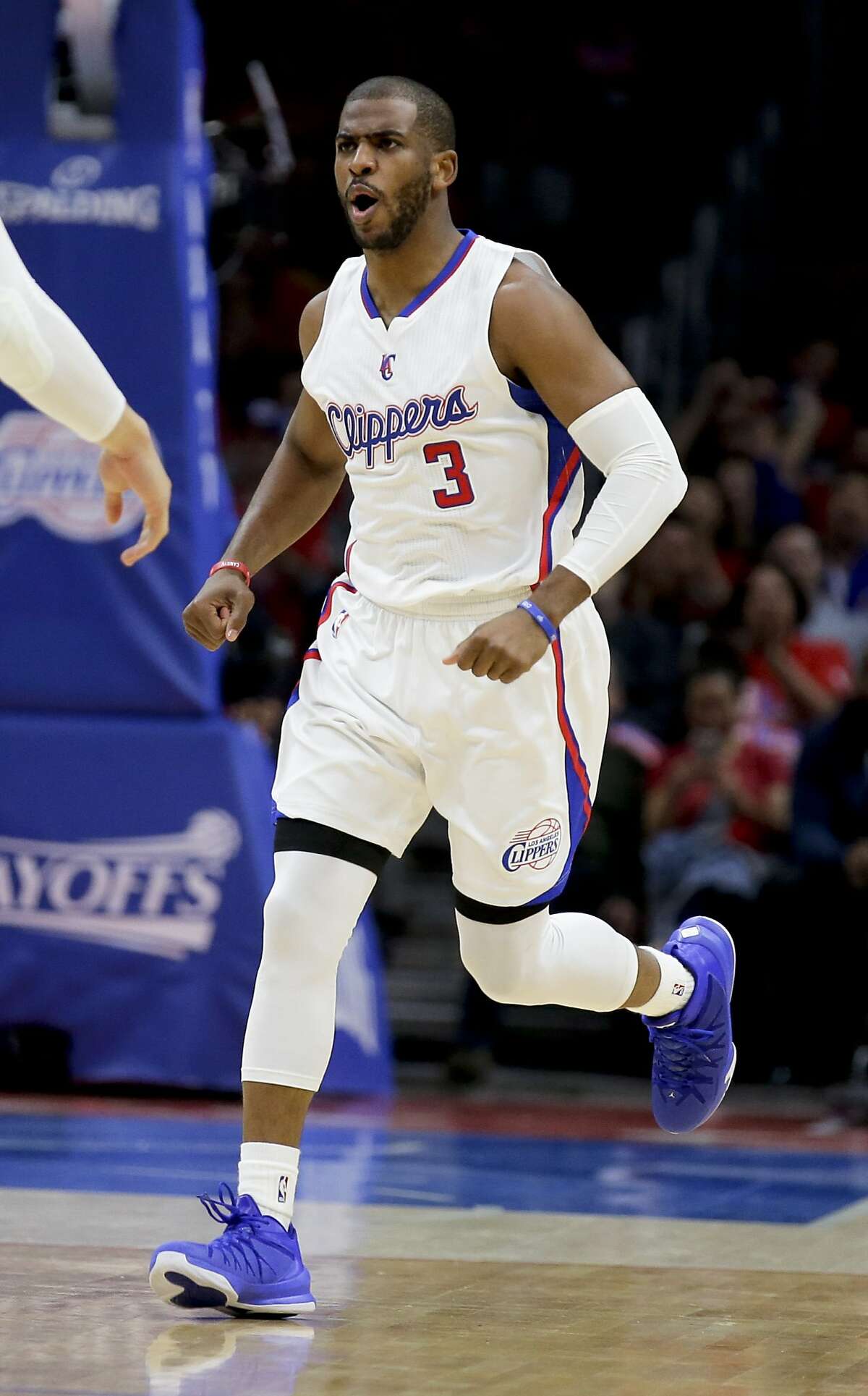 Los Angeles Clippers guard Chris Paul celebrates during Game 2 of a first-round NBA basketball playoff series against the San Antonio Spurs in Los Angeles, Thursday, April 23, 2015. The Spurs won 111-107 in overtime. (AP Photo/Chris Carlson)