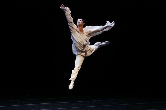 Wearing makeup done by Smuin ballet wardrobe assistant Vincent Avery, Ben Needham-Wood takes to the air during the final dress rehearsal at Yerba Buena Center for the Arts in san Francisco, Calif.