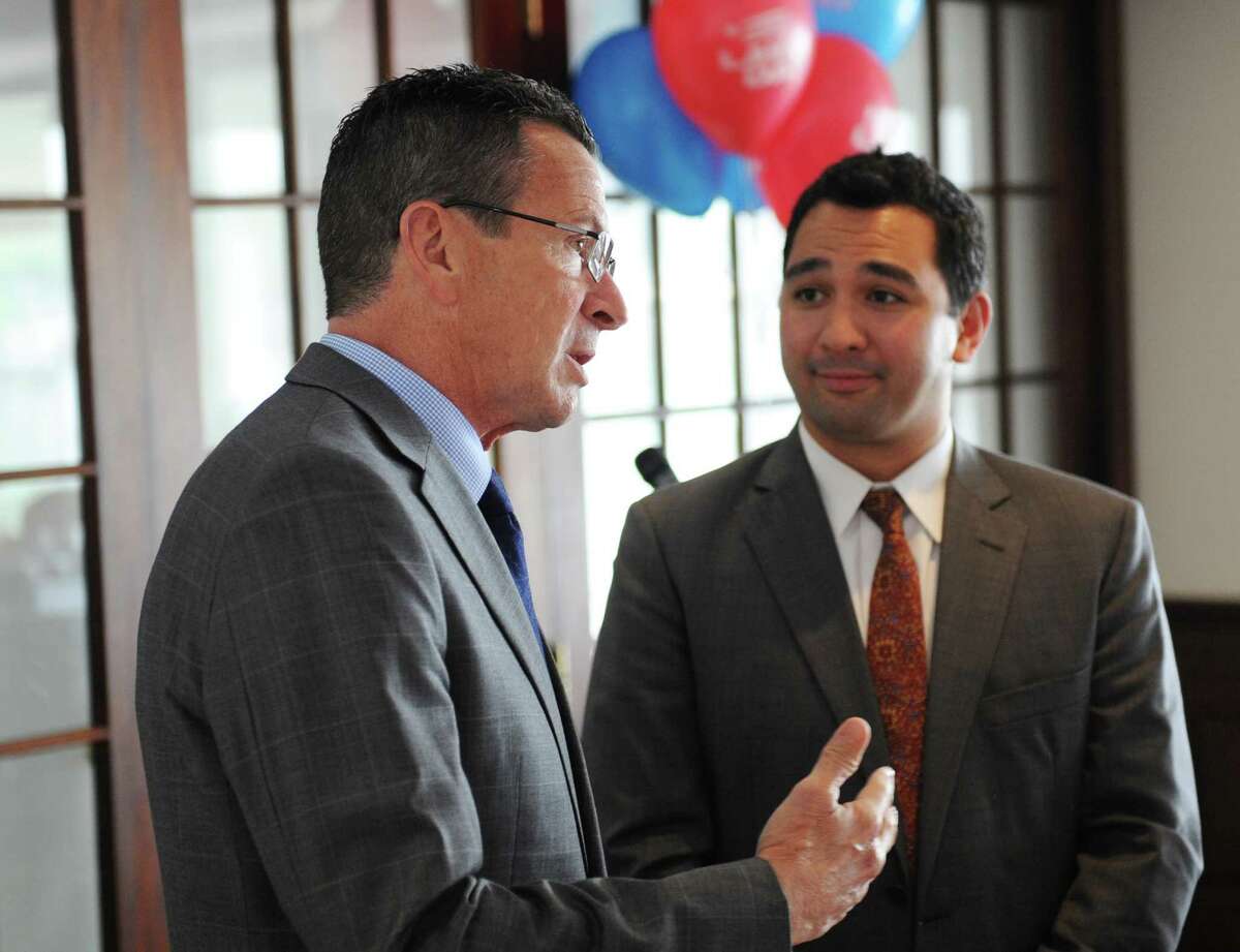 Connecticut Gov. Dannel P. Malloy, left, speaks with Law Day Chairman John Heagney during the Greenwich Bar Association Law Day Luncheon at the Indian Harbor Yacht Club in Greenwich, Conn. Friday, May 15, 2015. Connecticut Gov. Dannel P. Malloy, a former lawyer, attended to thank lawyers for their many years of practicing law. The 2015 Liberty Bell Award was awarded to the late town Selectman David Theis and Probate Court Chief Clerk Barbara Carbino.