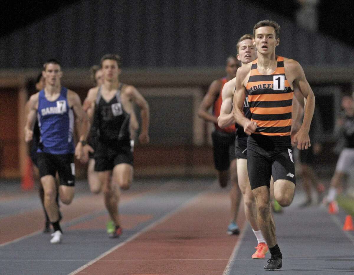 Johnathan Keating, from Ridgefield High School, leads the pack to the finish line of the boys 800 meter run at the 2015 Dream Invitational track meet held at Danbury High School, on Friday night, May 15, 2015, in Danbury, Conn. Keating won with a time of 1:56:42.