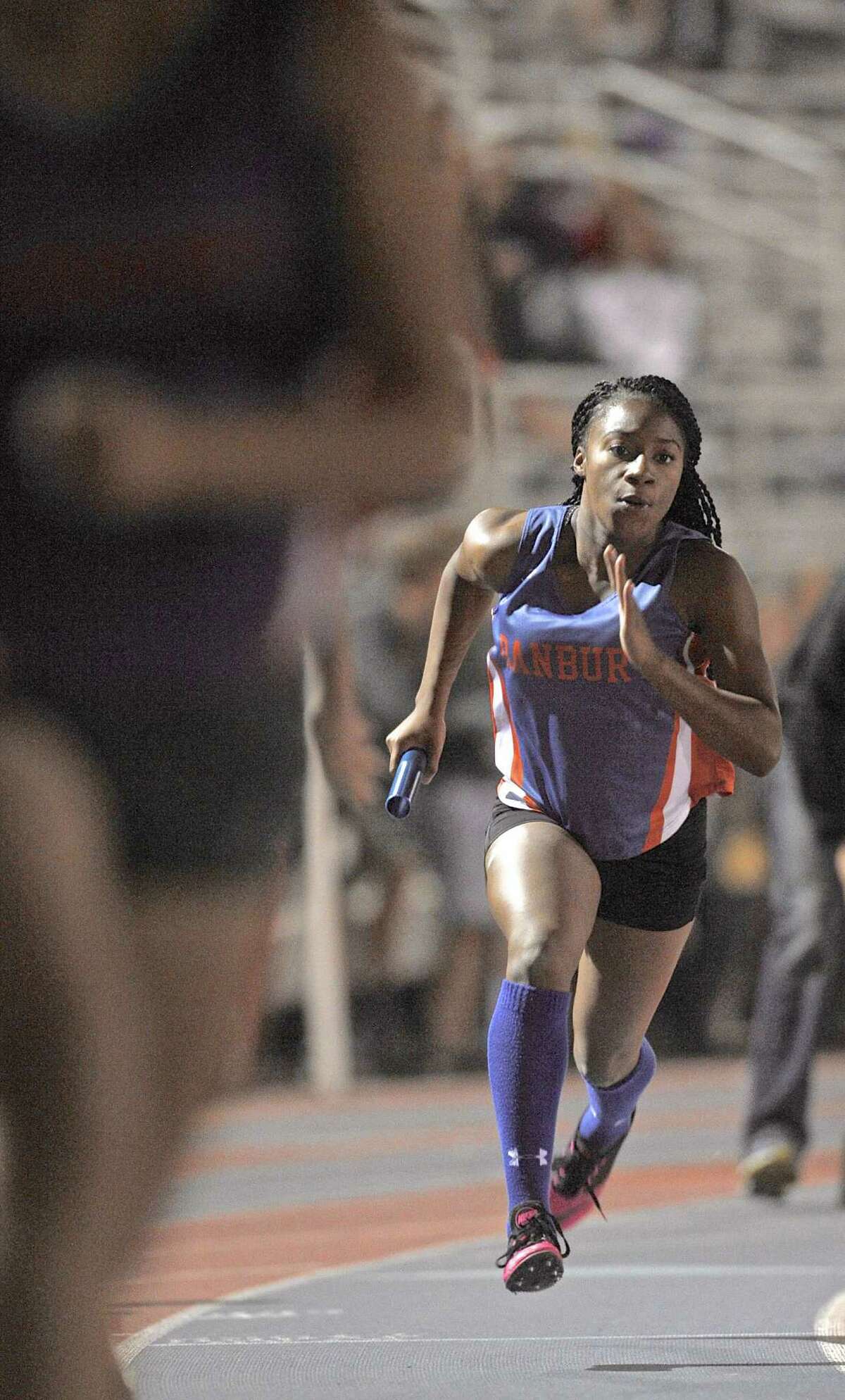 Zyniah Bunn, of Danbury High School, at the start of the girls 4x200 meter relay at the 2015 Dream Invitational track meet held at Danbury High School, on Friday night, May 15, 2015, in Danbury, Conn.
