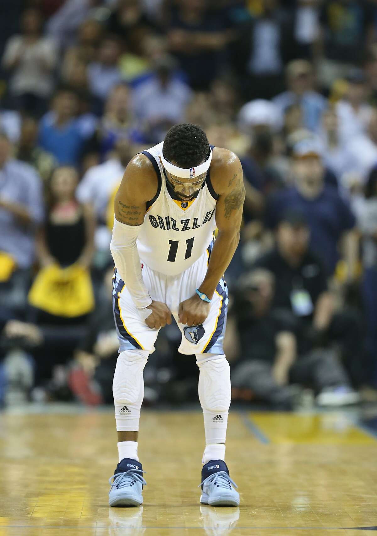 MEMPHIS, TN - MAY 15: Mike Conley #11 of the Memphis Grizzlies bends over in defeat in the final seconds of the game against the Golden State Warriors during Game six of the Western Conference Semifinals of the 2015 NBA Playoffs at FedExForum on May 15, 2015 in Memphis, Tennessee. NOTE TO USER: User expressly acknowledges and agrees that, by downloading and or using this photograph, User is consenting to the terms and conditions of the Getty Images License Agreement (Photo by Andy Lyons/Getty Images)