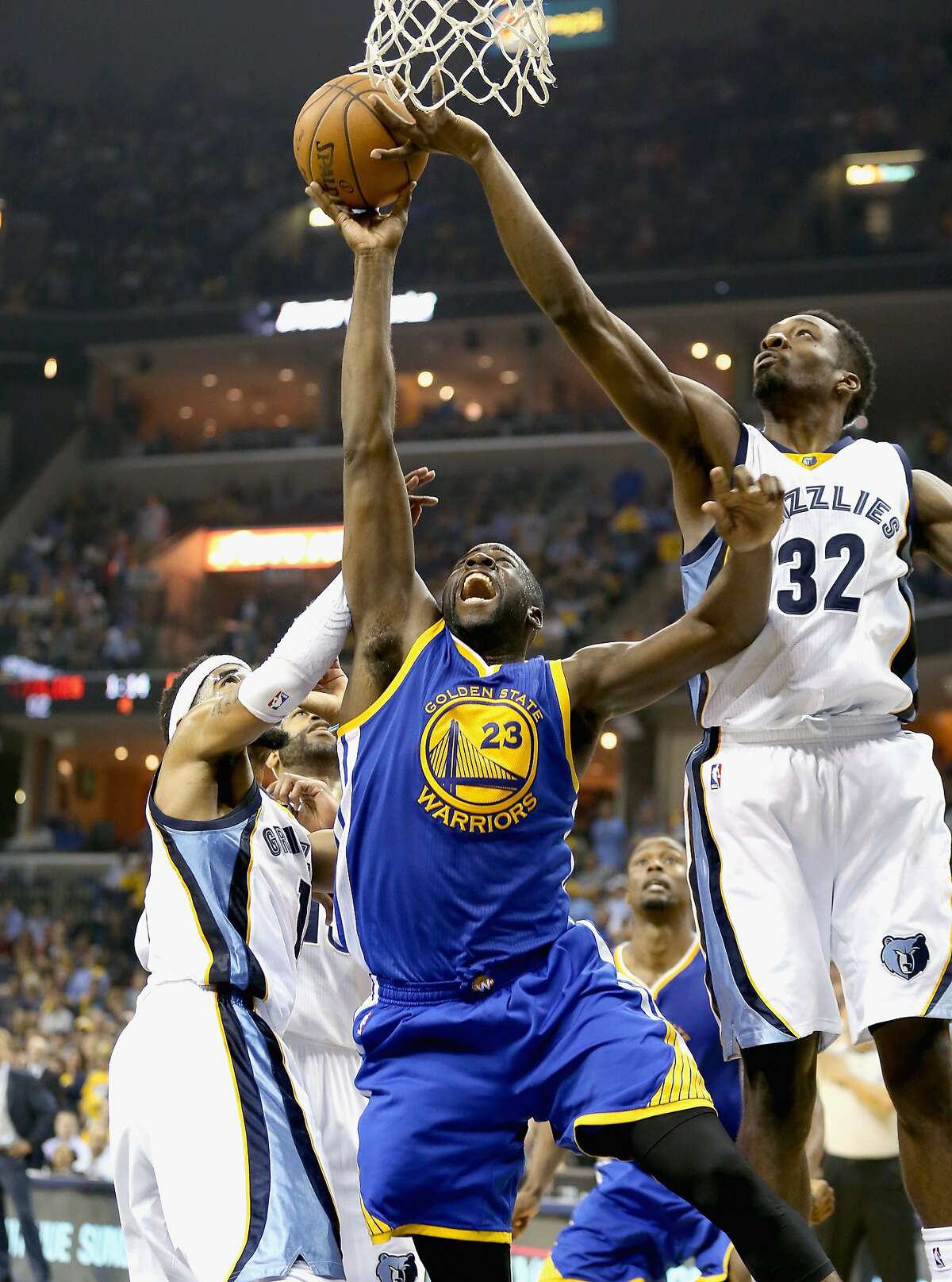 MEMPHIS, TN - MAY 15: Draymond Green #23 of the Golden State Warriors shoots the ball against the Memphis Grizzlies during Game six of the Western Conference Semifinals of the 2015 NBA Playoffs at FedExForum on May 15, 2015 in Memphis, Tennessee. NOTE TO USER: User expressly acknowledges and agrees that, by downloading and or using this photograph, User is consenting to the terms and conditions of the Getty Images License Agreement (Photo by Andy Lyons/Getty Images)