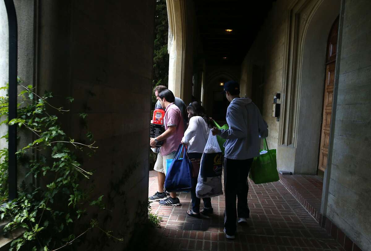 Joshua Godwin (left) moves out of Bowles Hall with the help of his family at UC Berkeley on Friday, May 15, 2015. The historic, castle-like mansion will close for a year to be gutted and rebuilt as a coed residential college.