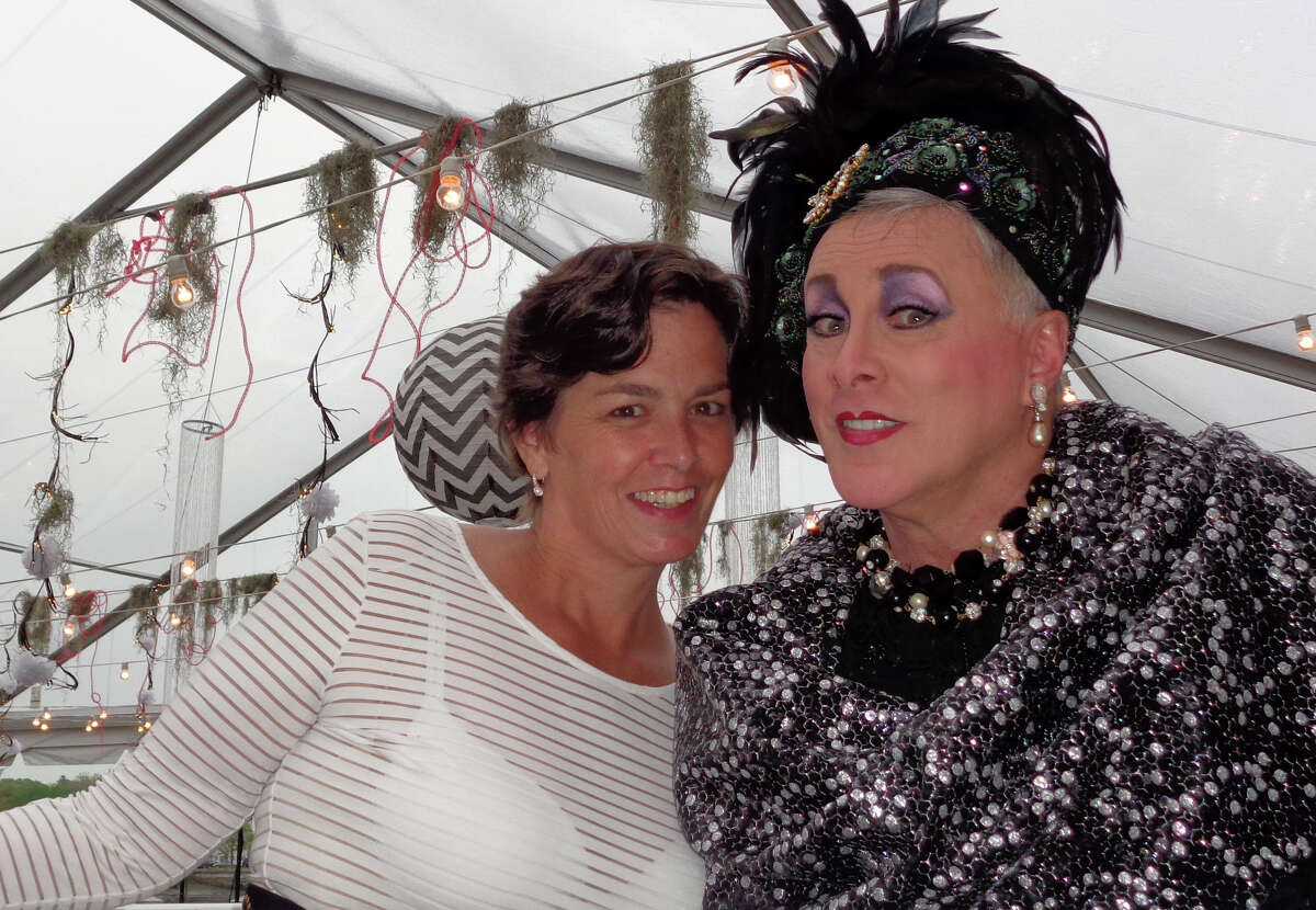 Alex Smith, left, a co-chairwoman of the gala, poses with Sybil Bruncheon, the auctioneer and drag queen from Manhattan, in a tent at the Green at National Hall for the Westport Arts Centerís Midnight in the Garden of Good & Evil fundraising gala Saturday.