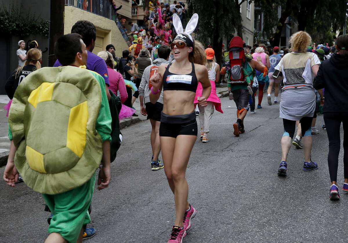 This bunny decided to take the hill backwards making the turtle jealous. The zany Bay to Breakers event in the streets of San Francisco, Calif. combined thousands of runners and unique costumes into one big party.
