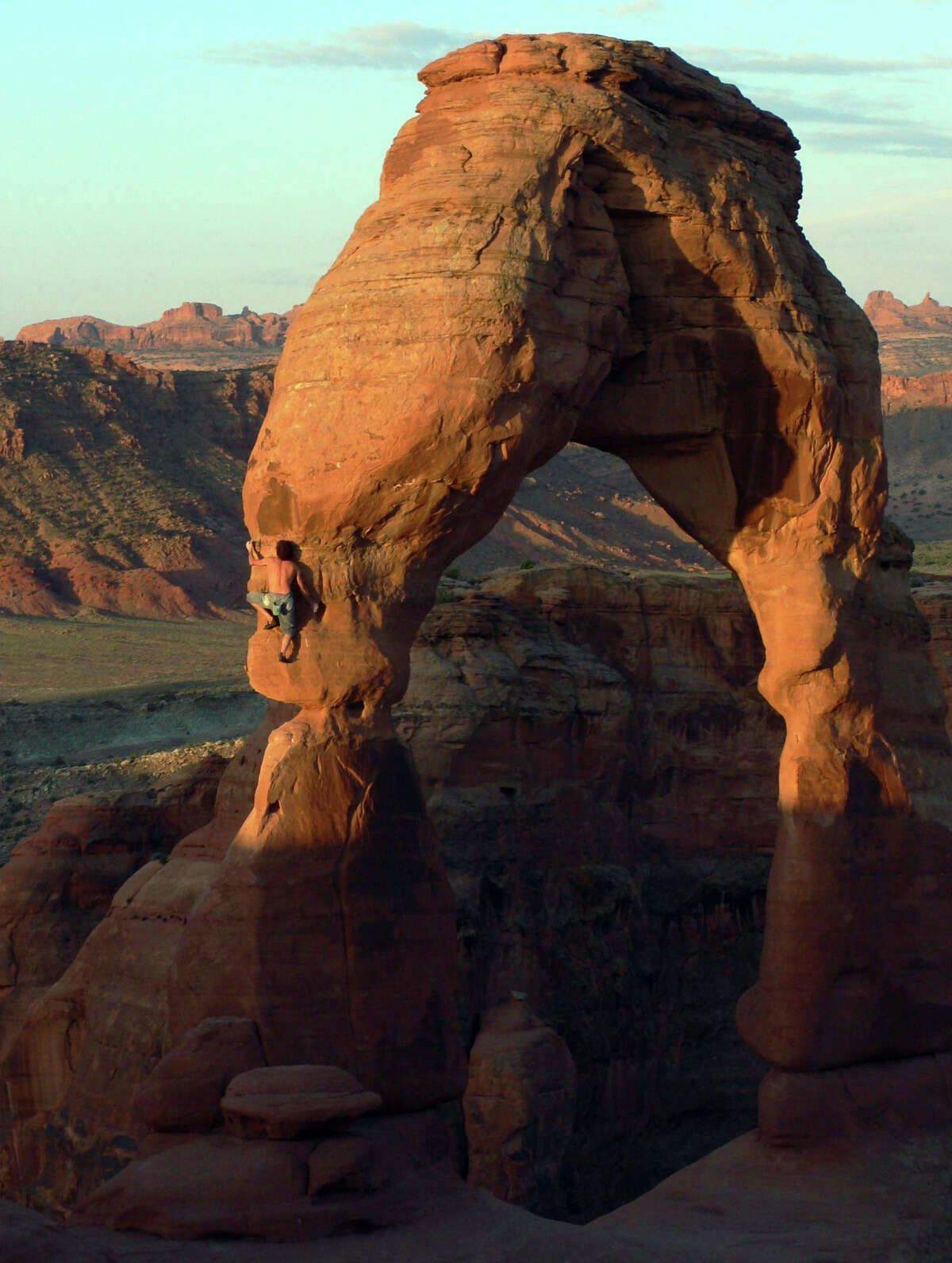 Famed rock climber Dean Potter makes his way up Delicate Arch in Arches National Park in Utah in 2006.