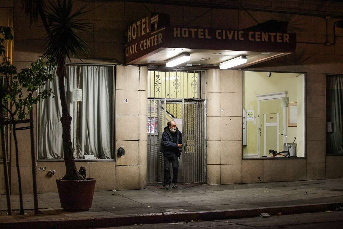 A man steps out of the Civic Center Hotel in San Francisco, California on May 16, 2015. There is a major plan to redevelop the Civic Center property on Market Street, the site of the run down Civic Center Hotel and the Plumber Union Hall. The development would include the large parking lots that wrap around both buildings. Current residents of the Hotel will be offered housing in an affordable development to be built onsite.