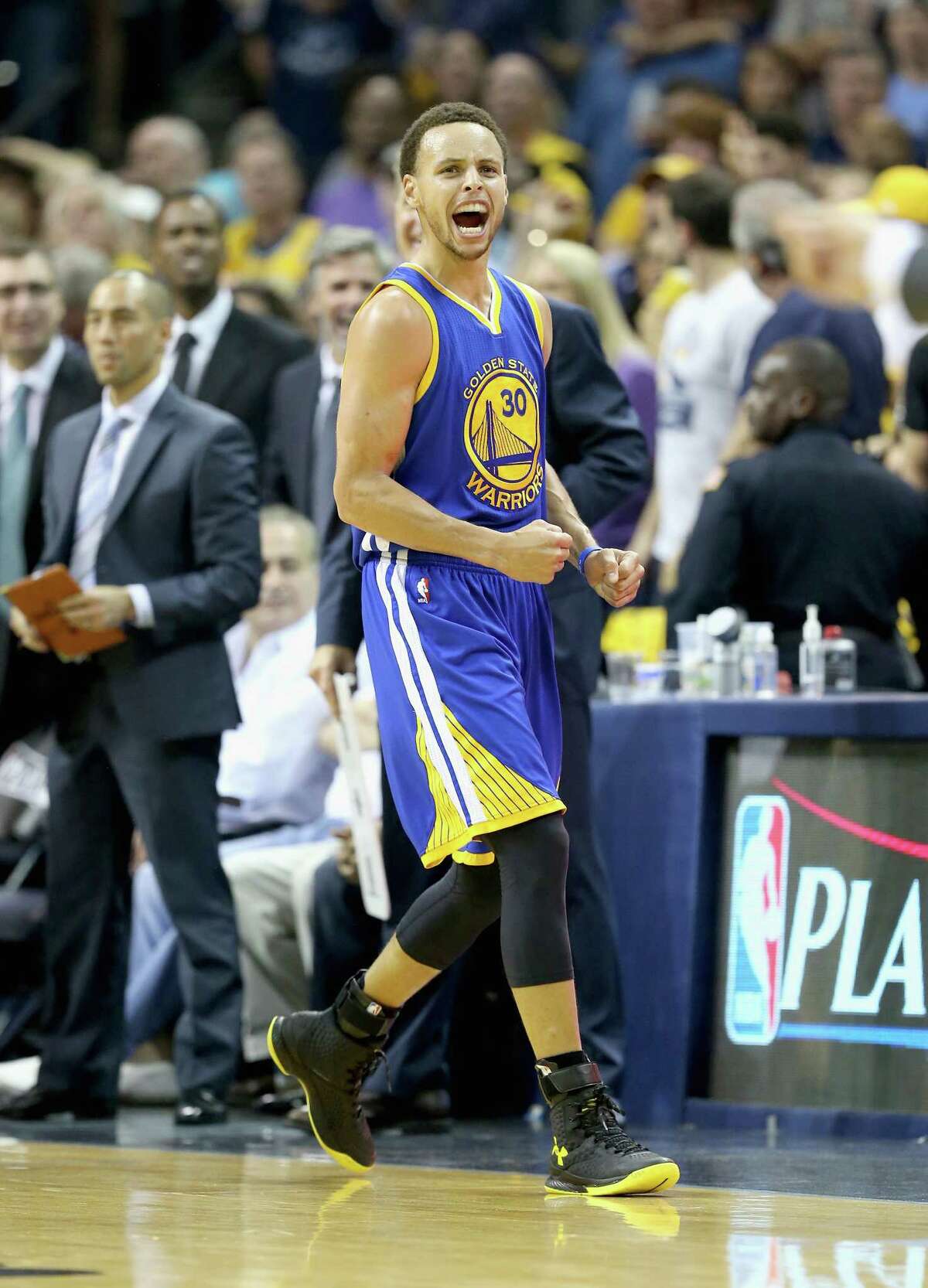 Stephen Curry of the Golden State Warriors celebrates after making a basket to end the third quarter against the Memphis Grizzlies during Game 6 of the Western Conference semifinals at FedExForum on May 15, 2015 in Memphis, Tennessee.