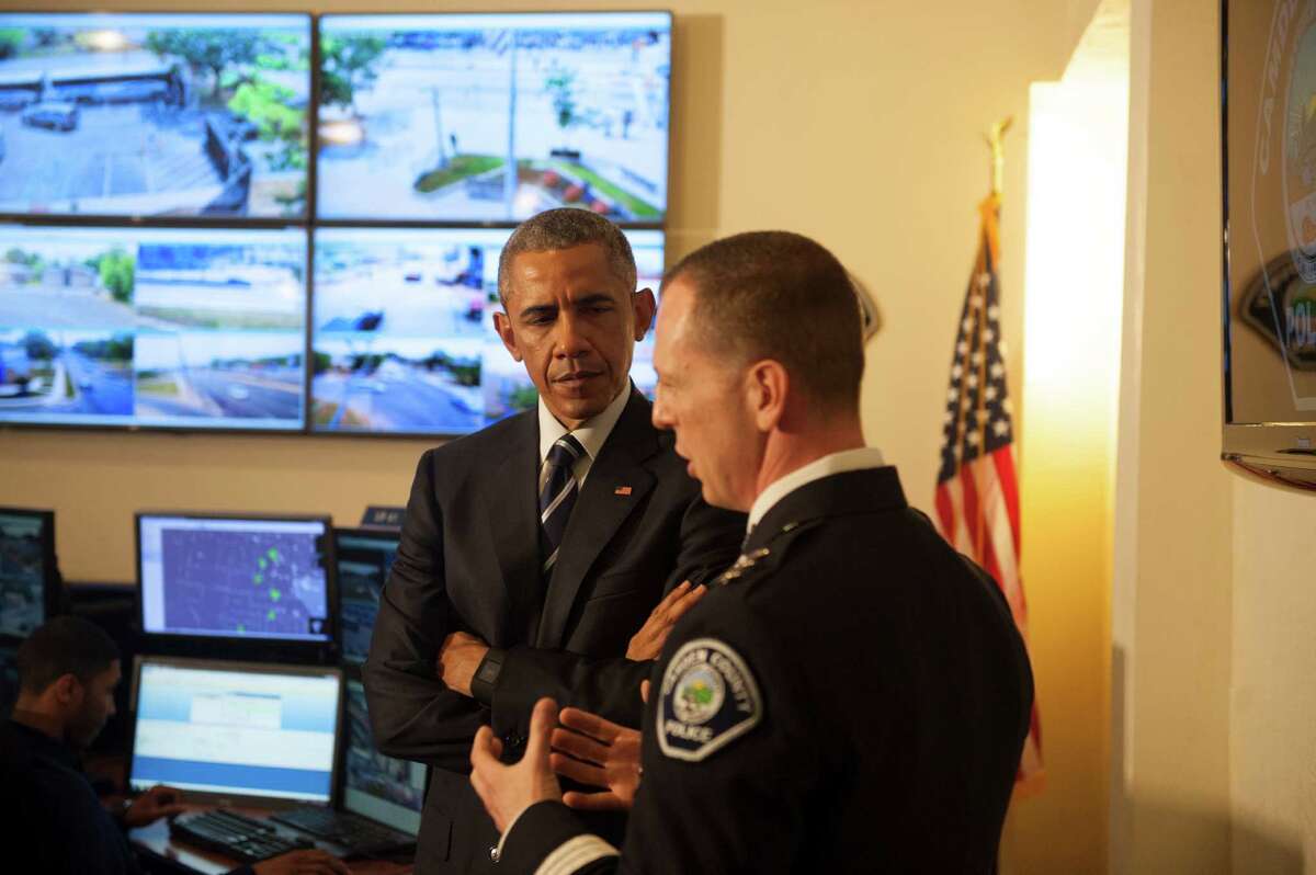 President Barack Obama tours the Real-Time Tactical Operational Intelligence Center in the Camden County Police Administration Building with Camden County Police Chief J. Scott Thomson on Monday, May 18, 2015, in Camden, N.J. (Chris LaChall/Camden Courier-Post via AP, Pool)