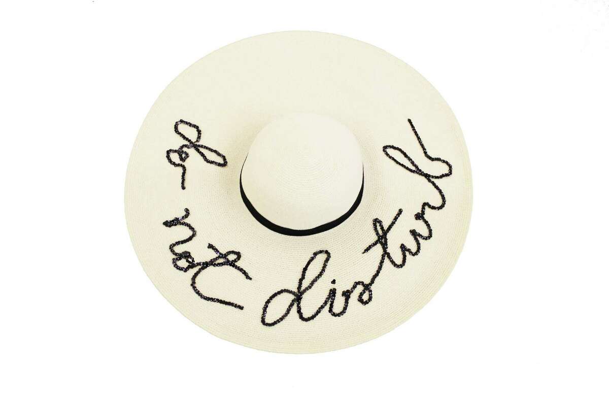 "Do Not Distrub" sunny sunhat ($440) by celebrity milliner Eugenia Kim.