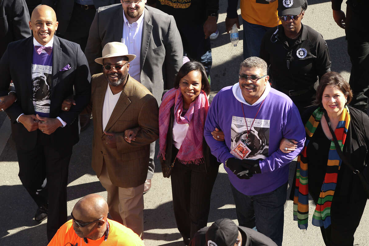 People take part in the 28th Martin Luther King March in San Antonio, Texas Monday Jan. 19, 2015. Pictured left to right are councilman Alan Warrick, Rodney Taylor (Mayor Ivy Taylor's husband). Mayor Ivy Taylor, MLK Commission chairman David Copeland and state senator Leticia Van de Putte.