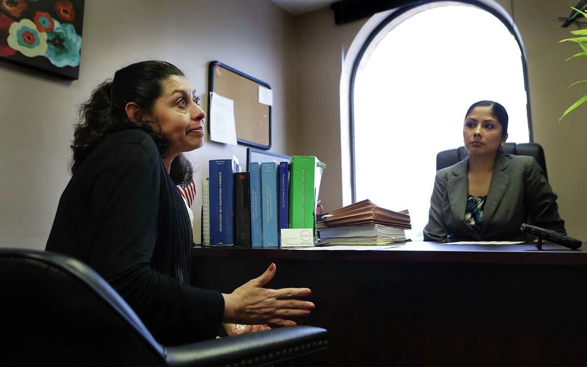 A tearful Lesly Cabrera, left, discusses with her lawyer Claudia Hernandez the next steps in her immigration case. The Honduran mother is seeking asylum here due to gang violence aimed at her 17 year-old son while they lived in San Pedro Sula, but was denied application for asylum in immigration court on Monday, May 18, 2015. Her son Edwuard has a separate case and hopes to gain residency.
