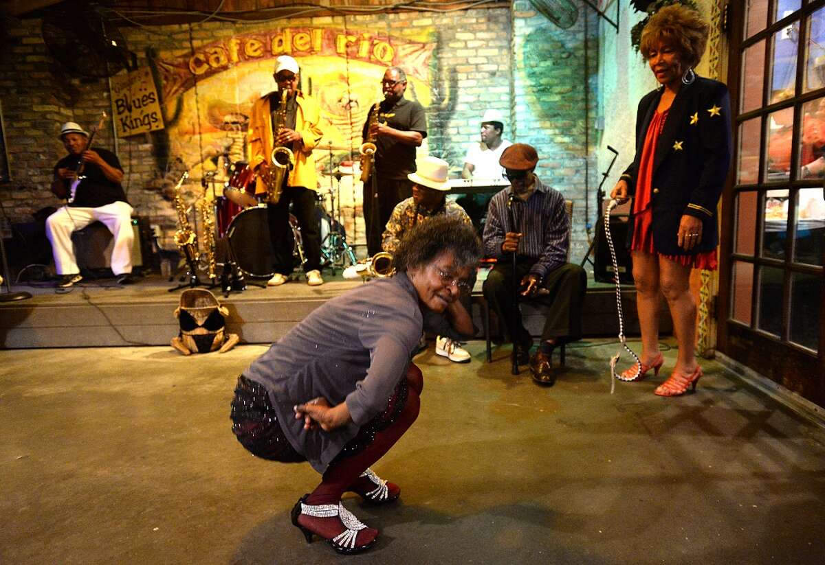 Ginger (right) watches as loyal fan and avid dancer Ida gets down as Ginger and the Rhythm & Blues Kings perform Saturday night at Cafe Del Rio. Photo taken Saturday, March 28, 2015 Kim Brent/The Enterprise