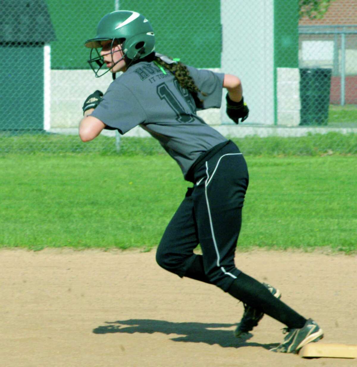 Green Wave senior Emily Delaney gets a quick break from second base during New Milford High School softball's game vs. Pomperaug, May 11, 2015 at NMHS.