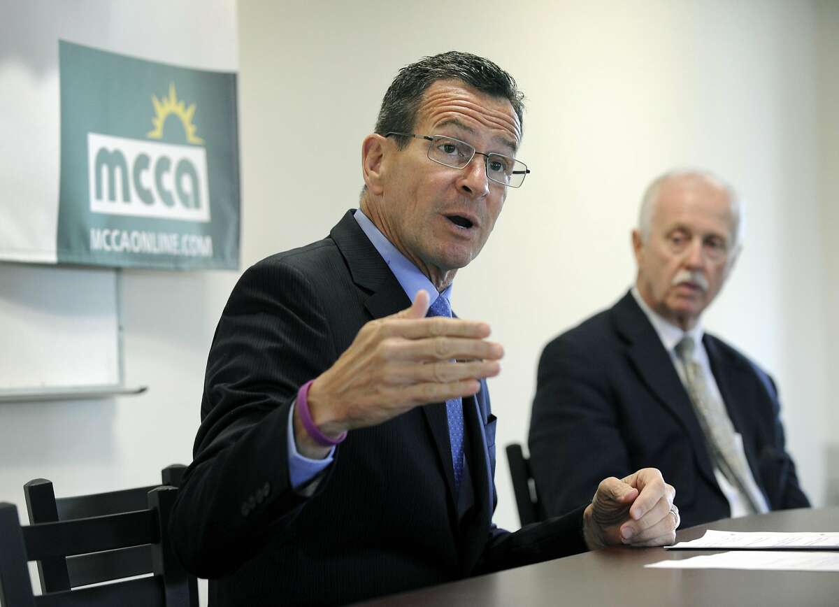Gov. Dannel P. Malloy holds a news conference at the Midwestern Connecticut Council of Alcoholism (MCCA) in Danbury, Conn., Monday, May 18, 2015. Right is Joseph Sullivan, president and CEO of MCCA.