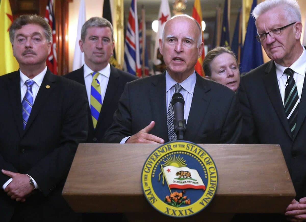 Gov. Jerry Brown is joined by state officials from around the world at the ceremony in Sacramento.