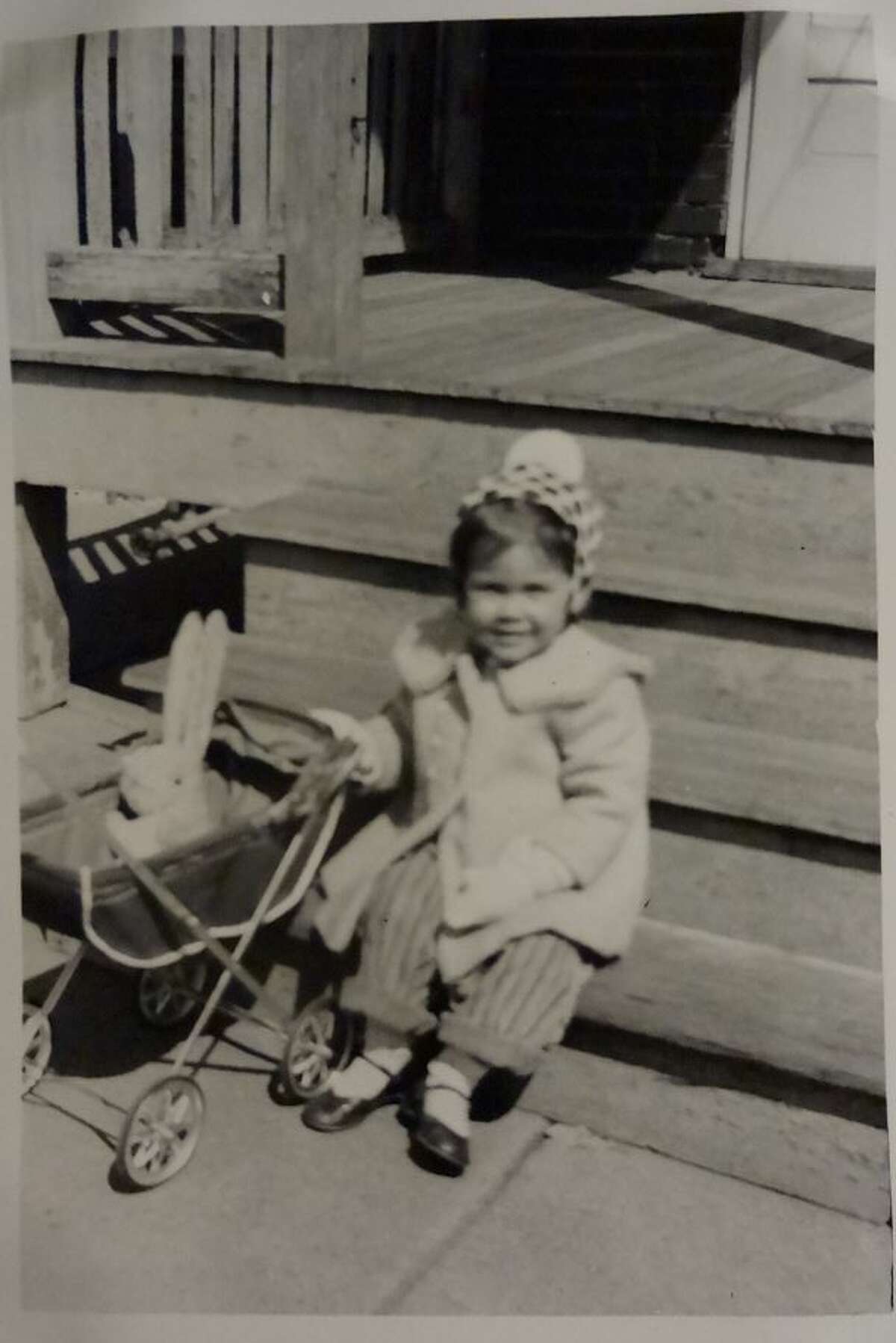 Naomi Shihab Nye with her bunny in a carriage in 1954.