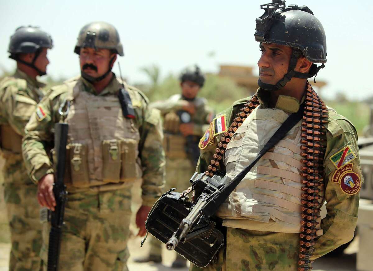 Iraqi soldiers in the Garma district of Anbar province strategize on ways to recapture Ramadi from ISIS.