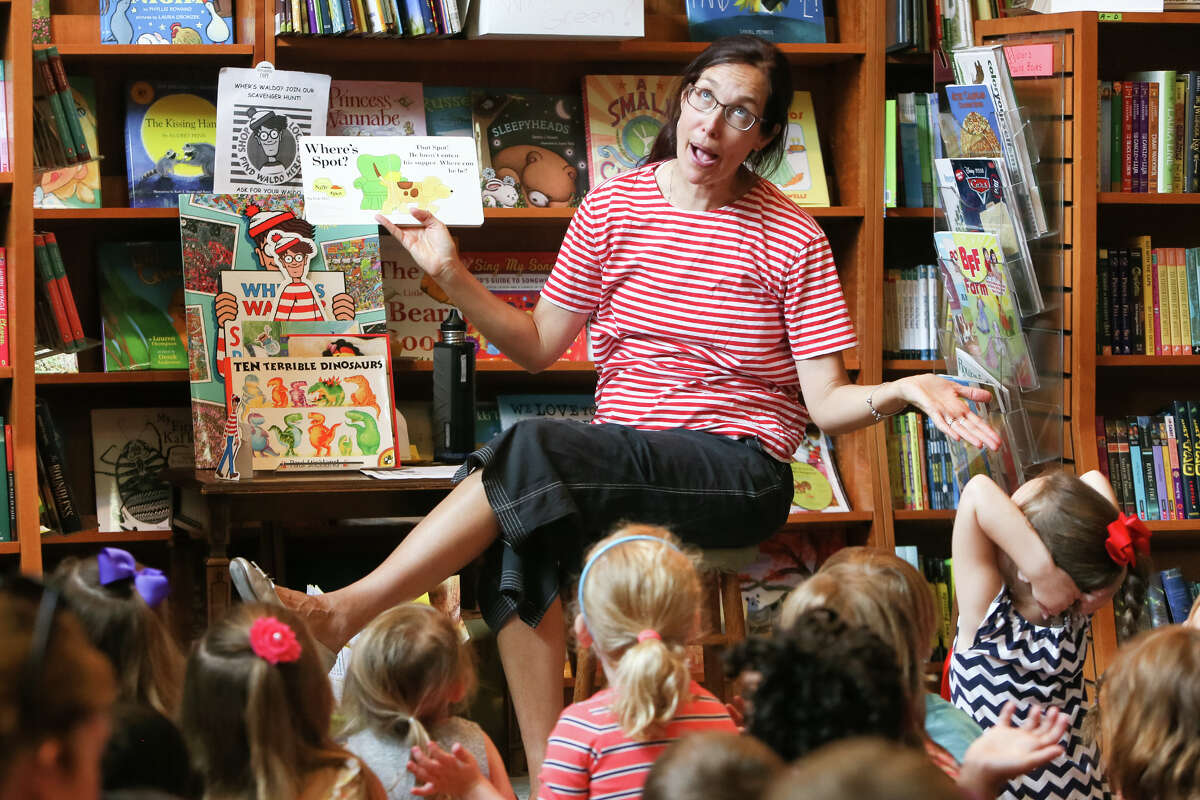 Anastasia McKenna, aka Miss Anastasia, reads to a group of children at The Twig Book Shop last year.