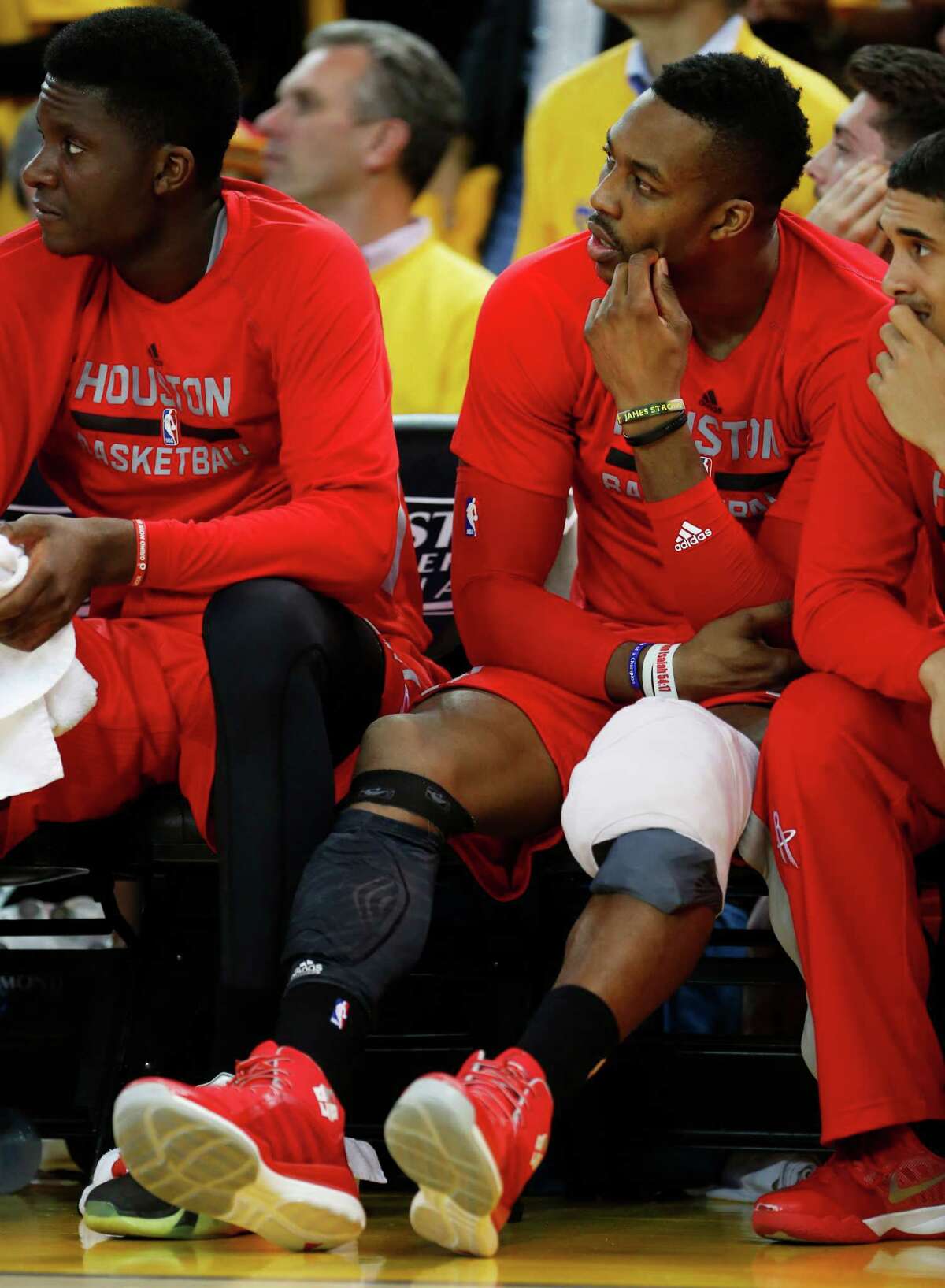 Houston Rockets center Dwight Howard (12) sits on the bench with ice on his knee during the fourth quarter of Game 1 of the NBA Western Conference Finals against the Golden State Warriors at Oracle Arena on Tuesday, May 19, 2015, in Oakland. ( James Nielsen / Houston Chronicle )