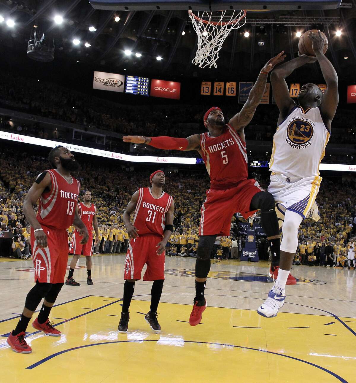 Draymond Green (23) shoots during the second half as the Golden State Warriors played the Houston Rockets in Game 1 of the Western Conference finals at Oracle Arena in Oakland, Calif., on Tuesday, May 19, 2015. The Warriors defeated the Rockets 110-106.