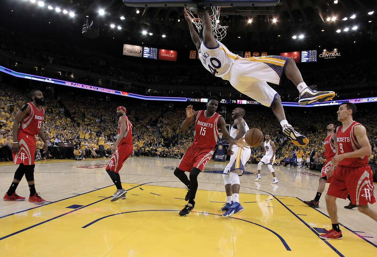 Harrison Barnes (40) dunks during the second half as the Golden State Warriors played the Houston Rockets in Game 1 of the Western Conference finals at Oracle Arena in Oakland, Calif., on Tuesday, May 19, 2015. The Warriors defeated the Rockets 110-106.