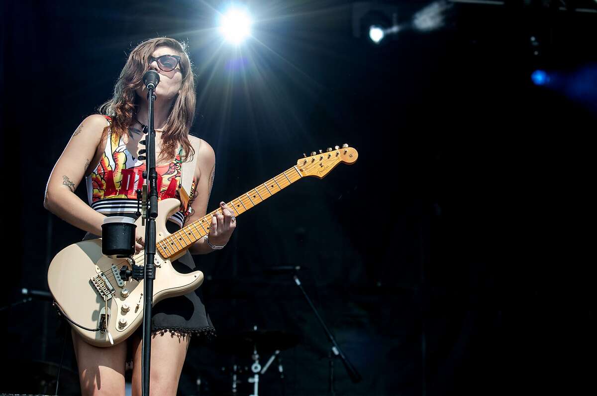 Bethany Cosentino, lead singer for the band Best Coast, performs at the third annual Shaky Knees Music Festival on Sunday, May 10, 2015, in Atlanta. The three-day festival enjoyed it's first full run under sunny skies after the first two years saw heavy rains that left attendees drenched. (AP Photo/Ron Harris)