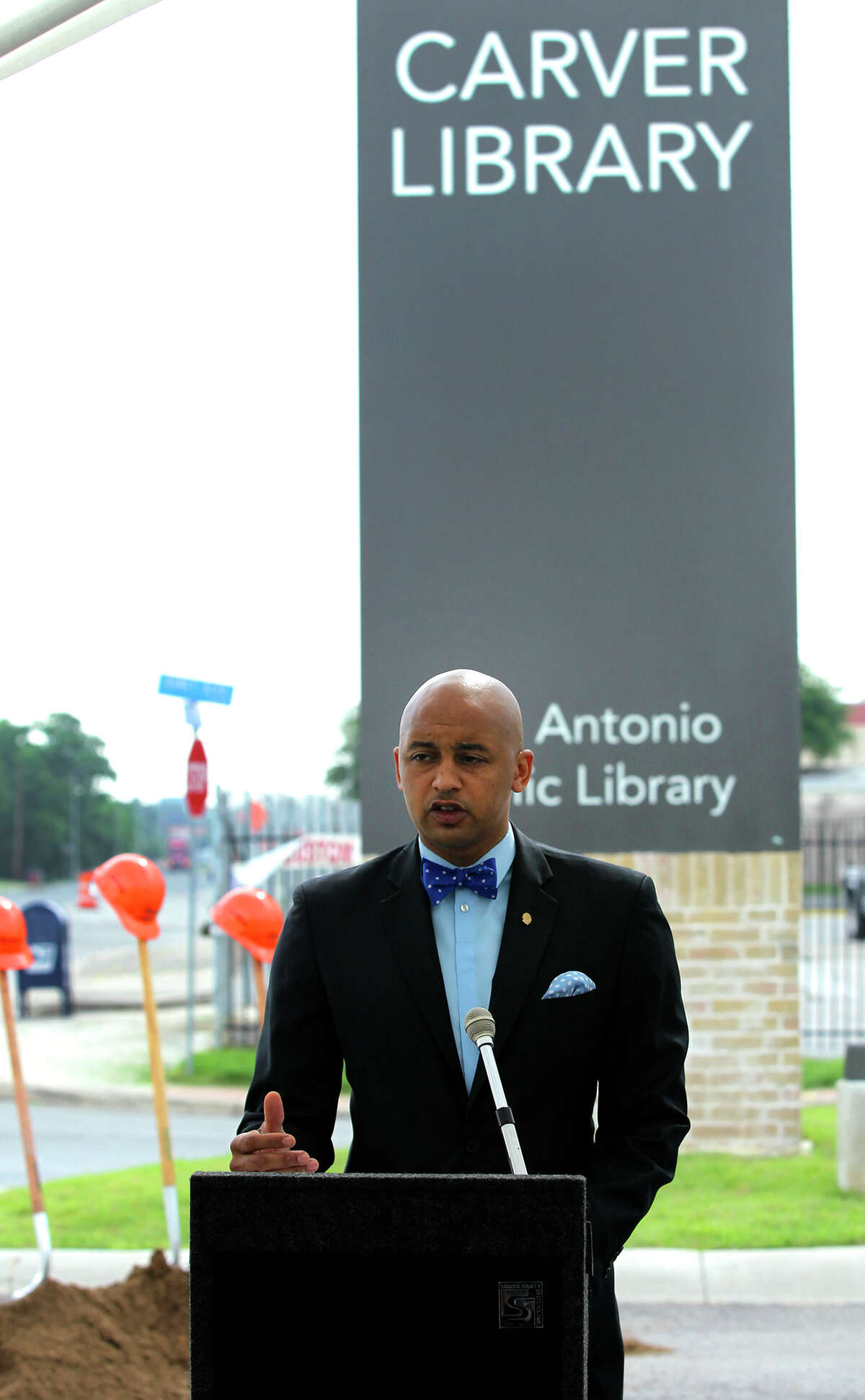 District 2 Councilman Alan E. Warrick II speaks Wednesday before a groundbreaking ceremony at the Carver Branch Library for a new bridge. The Commerce Street bridge, in the 3400 block of East Commerce over Salado Creek, will be rebuilt and Commerce Street will be reconstructed from East Houston Street to North Rio Grande Street. The bridge will have four lanes and sidewalks on each side with a connection to the hike-and-bike trail below on the Salado Creek Greenway. The project is funded with $11 million from the voter-approved 2012-2017 bond.