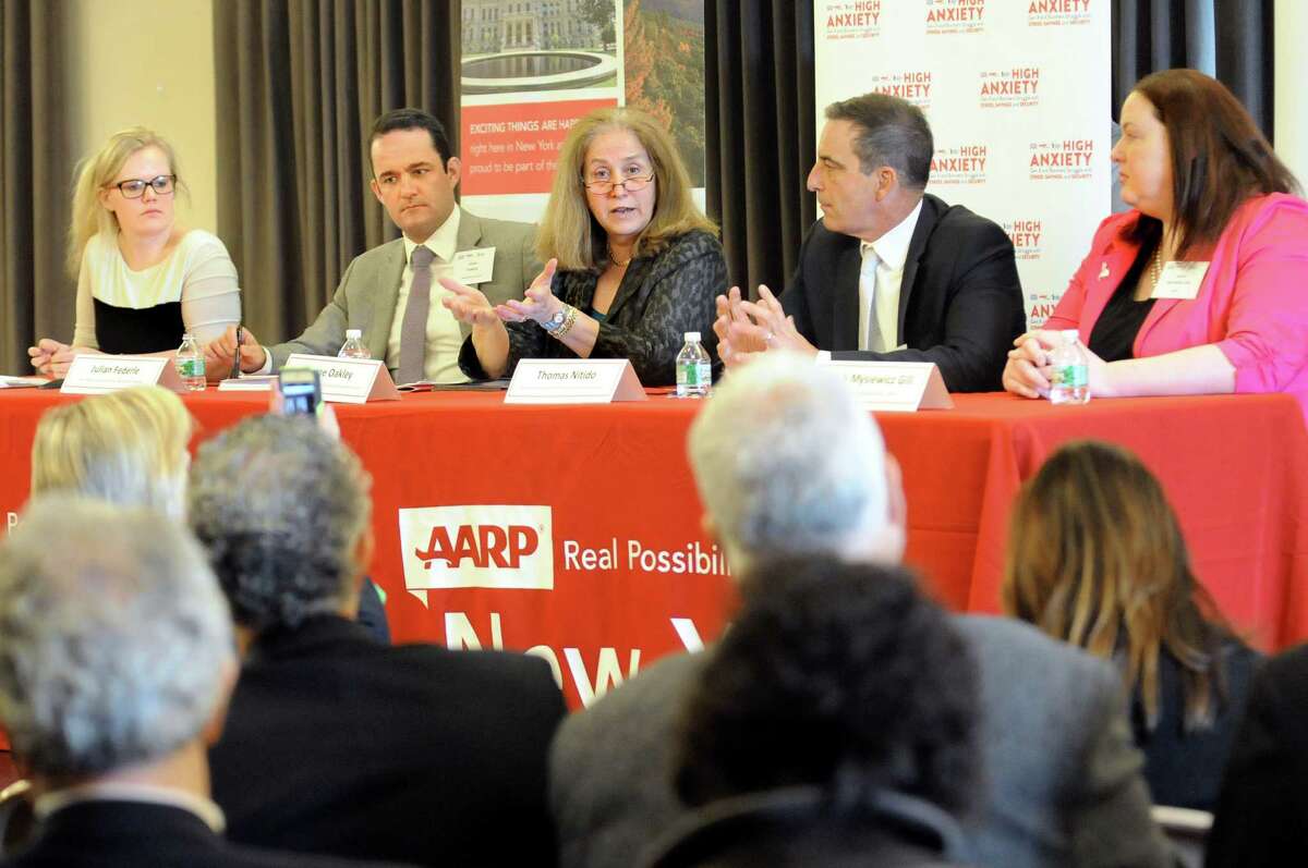 Diane Oakley, executive director of the National Institute of Retirement Security, center, speaks during an AARP sponsored panel discussion about retirement readiness on Wednesday, May 20, 2015, at the Albany Institute of History and Art in Albany, N.Y. Joining her, from left, are moderator Ashley Hupfl, Julian Federle, chief policy and programs officer; Thomas Nitido, deputy comptroller for New York State; and Sarah Mysiewicz Gill, senior legislative representative for AARP. (Cindy Schultz / Times Union)