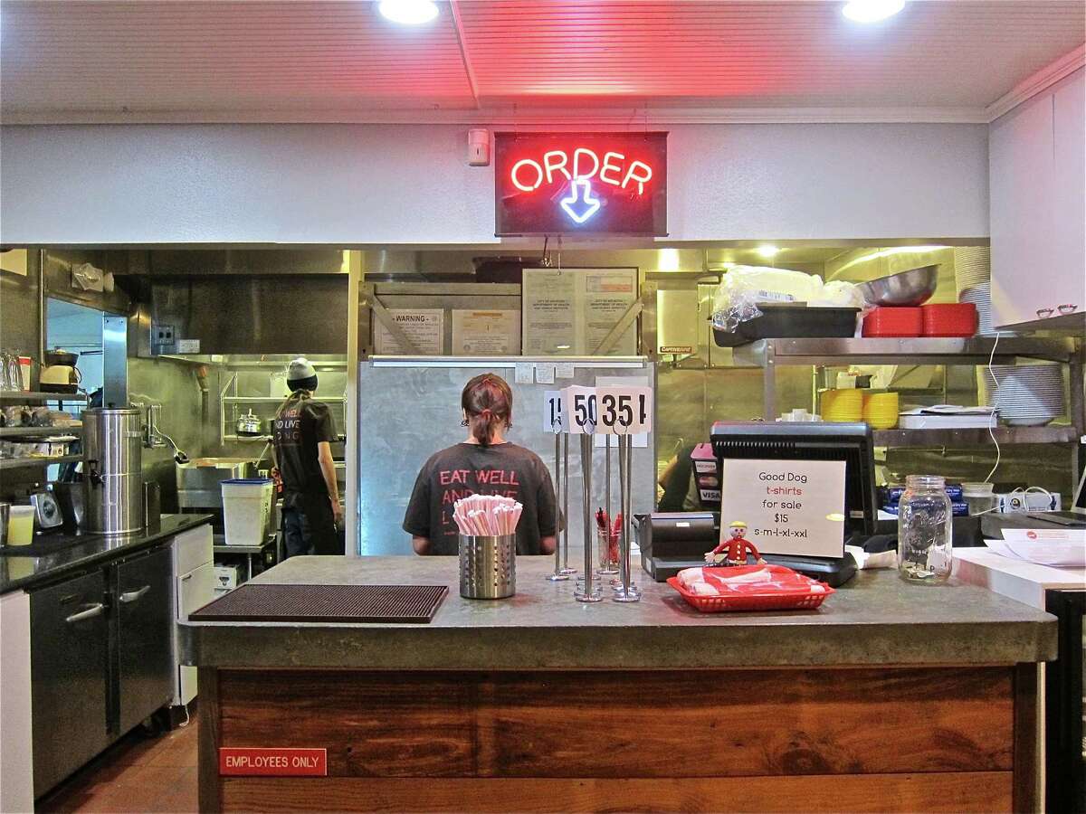 Customers order food at the counter at Good Dog Houston.