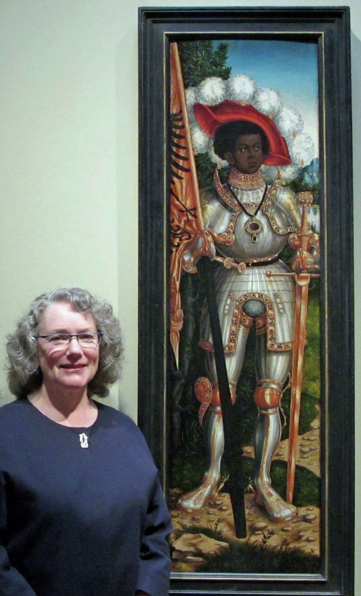 Old Greenwich resident and Metropolitan Museum of Art Curator Maryan Ainsworth stands before "Saint Maurice" by Lucas Cranach the Elder, at the Met.