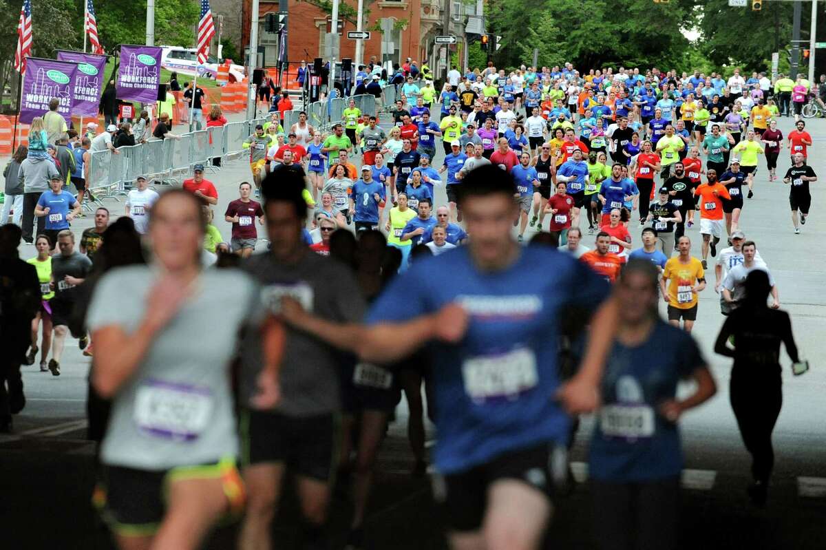 Participants race for the finish line during the CDPHP Workforce Team Challenge on Thursday, May 21, 2015, in Albany, N.Y. More than 10,000 runners and walkers signed up from 500-plus organizations. (Cindy Schultz / Times Union)