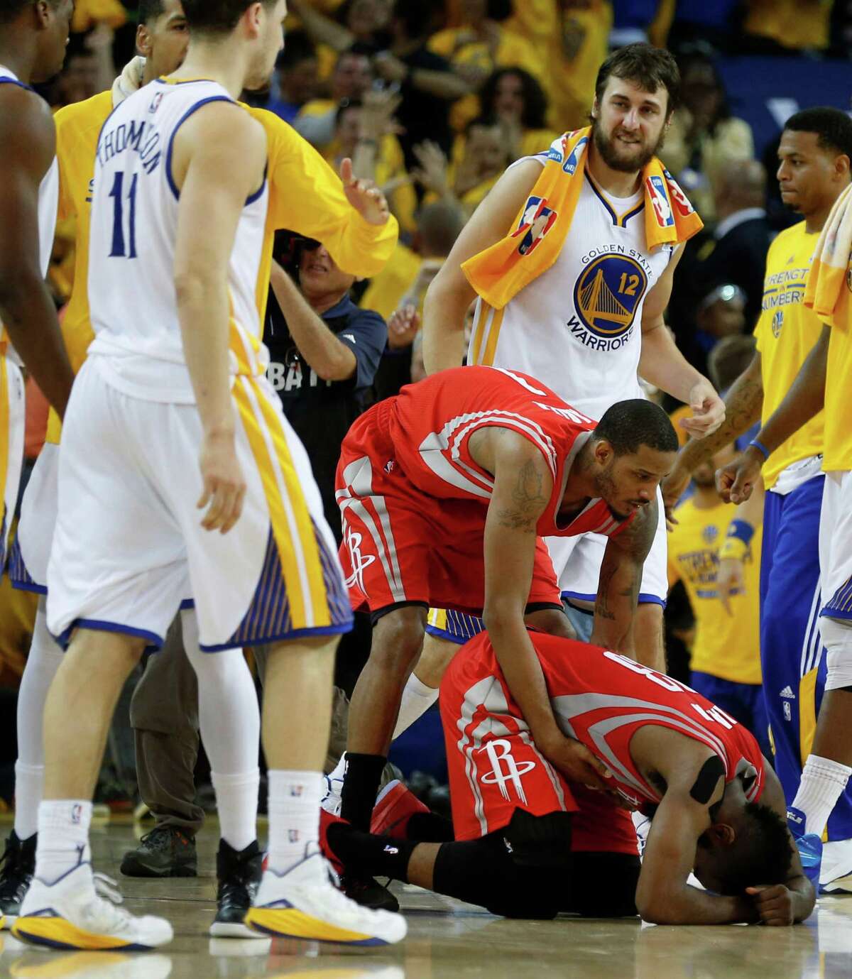 The Golden State Warriors' Stephen Curry defends against the Denver Nuggets'  Andre Iguodala (9) in the first quarter of Game 6 of their first-round NBA  Playoff series on Thursday, May 2, 2013