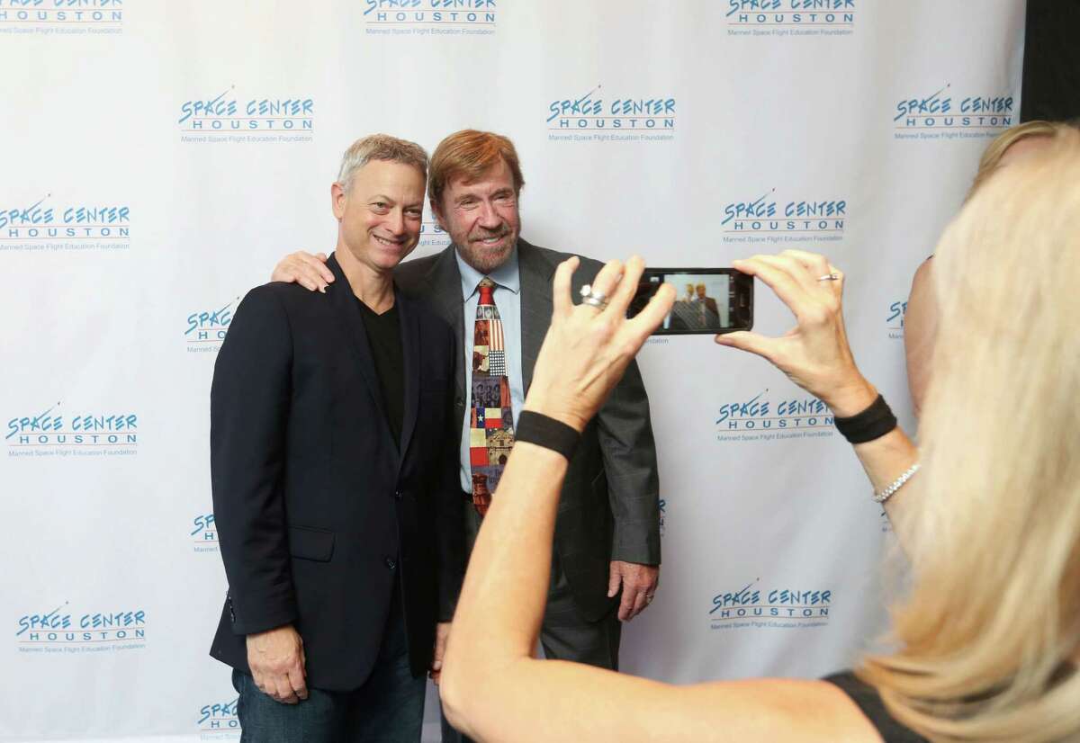 Gena Norris takes a photo of Gary Sinise and Chuck Norris at the Space Center Houston Galaxy Gala.