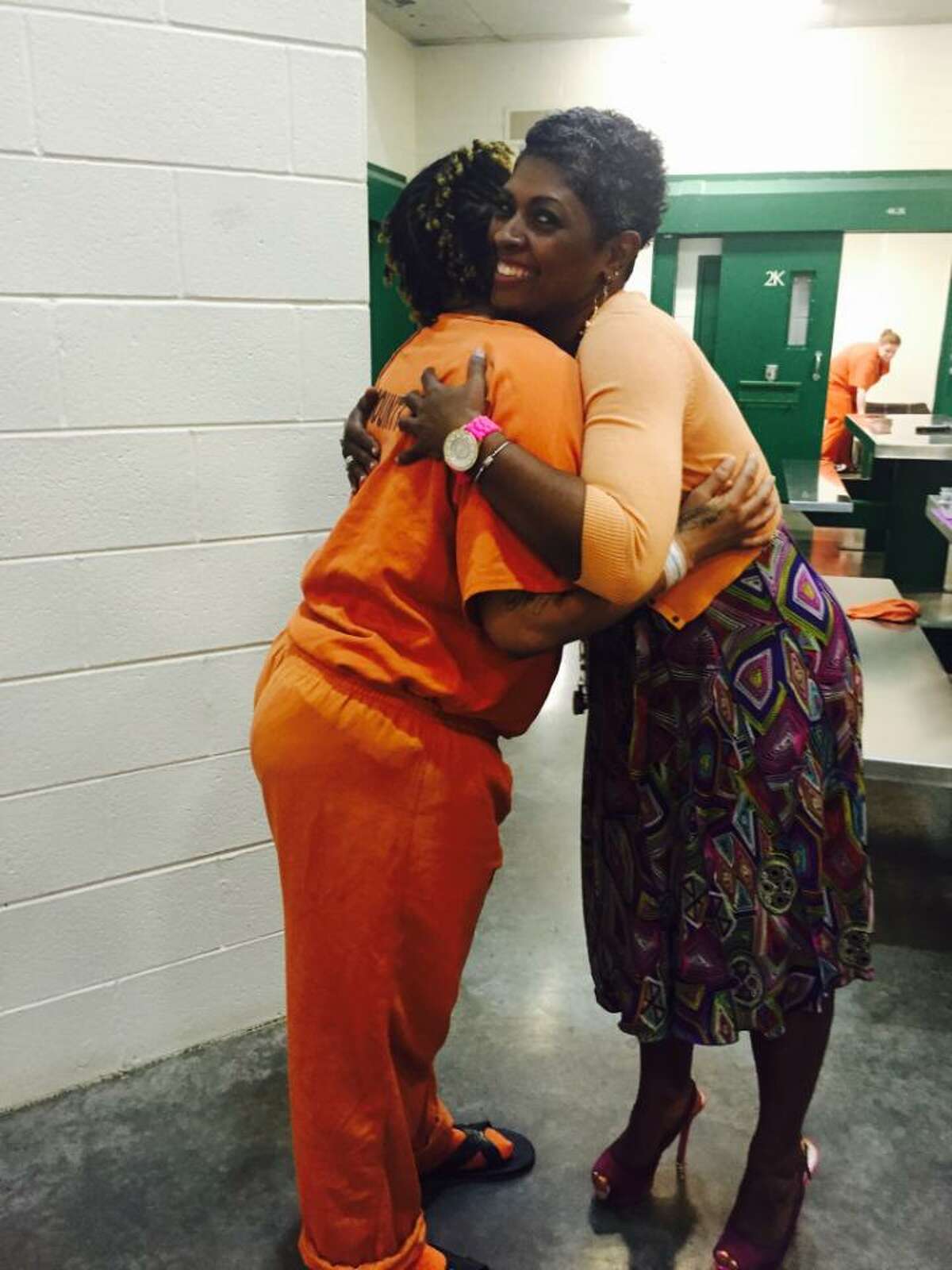 Jennifer Herring hugs an inmate in Harris County Jail's post-partum and pregnancy unit.