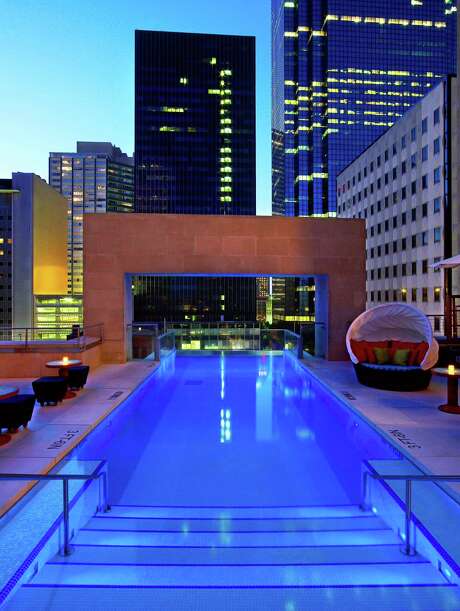 The Joule's rooftop pool extends past the building's edge, giving guests the sensation of swimming out into the air.