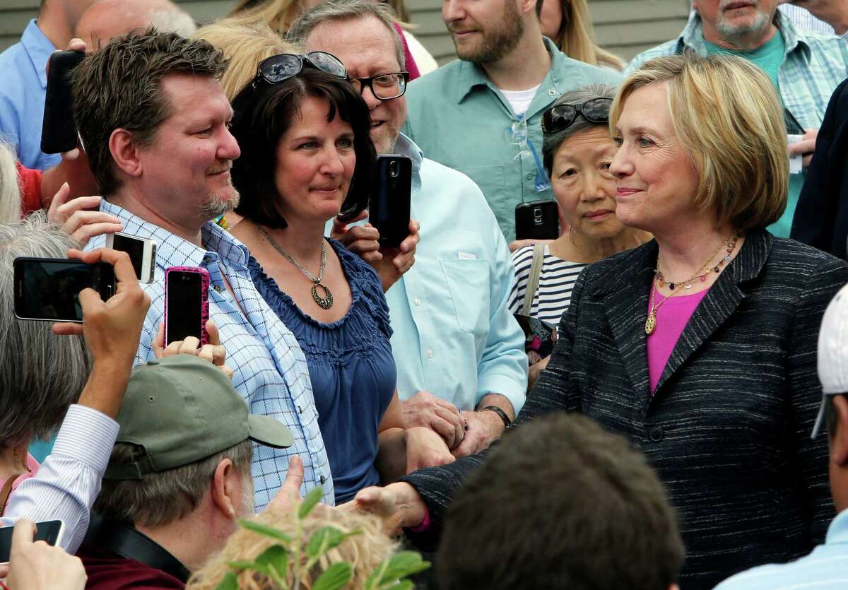 Democratic presidential candidate Hillary Rodham Clinton shakes hands after touring the Smuttynose Brewery, Friday, May 22, 2015, in Hampton, N.H. (AP Photo/Jim Cole) ORG XMIT: NHJC112