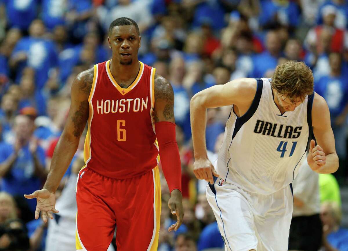 Houston Rockets forward Terrence Jones left, and Dallas Mavericks forward Dirk Nowitzki during the second half of Game 4 in the first round of NBA basketball playoffs at the American Airlines Center Sunday, April 26, 2015, in Dallas. ( James Nielsen / Houston Chronicle )