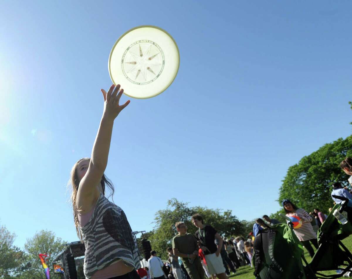 Alta Stratton, 11, of Greenwich, throws a flying disc during the Greenwich Town Party at Roger Sherman Baldwin Park, Greenwich, Conn., Saturday, May 23, 2015.