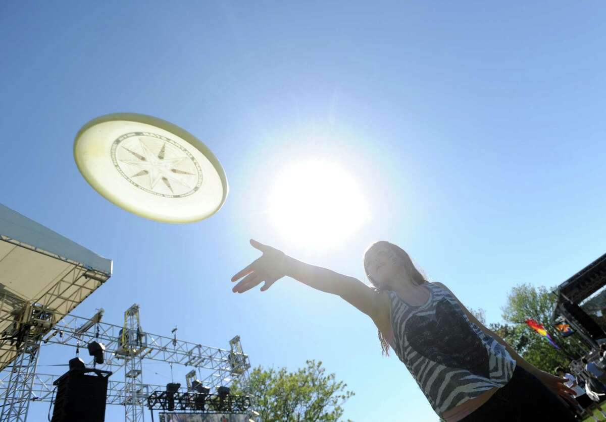 Alta Stratton, 11, of Greenwich, throws a flying disc during the Greenwich Town Party at Roger Sherman Baldwin Park, Greenwich, Conn., Saturday, May 23, 2015.