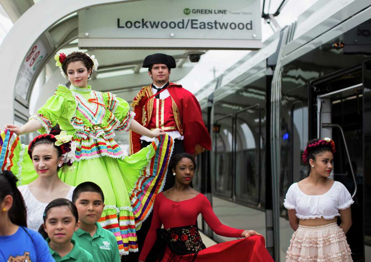 From top left, Lauren Martinez, 15, Chris Martinez, 22, Allana Brown, 17, and Maria Perez, seen at Lockwood-Eastwood rail stop wearing ﻿performance clothes, helped to﻿ inaugurate the MetroRail Green and Purple Lines on May 23.﻿