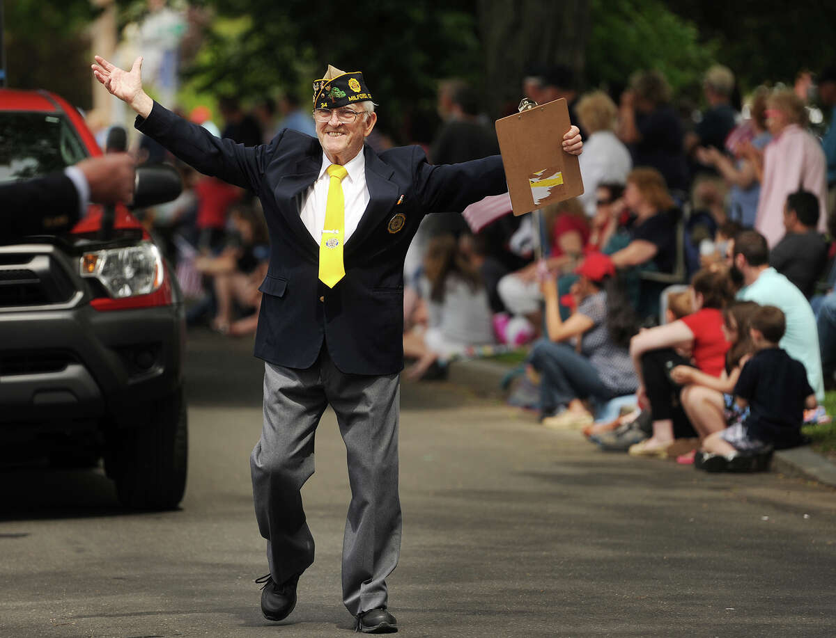 Army veteran Wayne Carson, of Milford, acknowledges the crowd after being announced from the reviewing stand at the annual Memorial Day Parade in Milford, Conn, on Sunday, May 24, 2015.