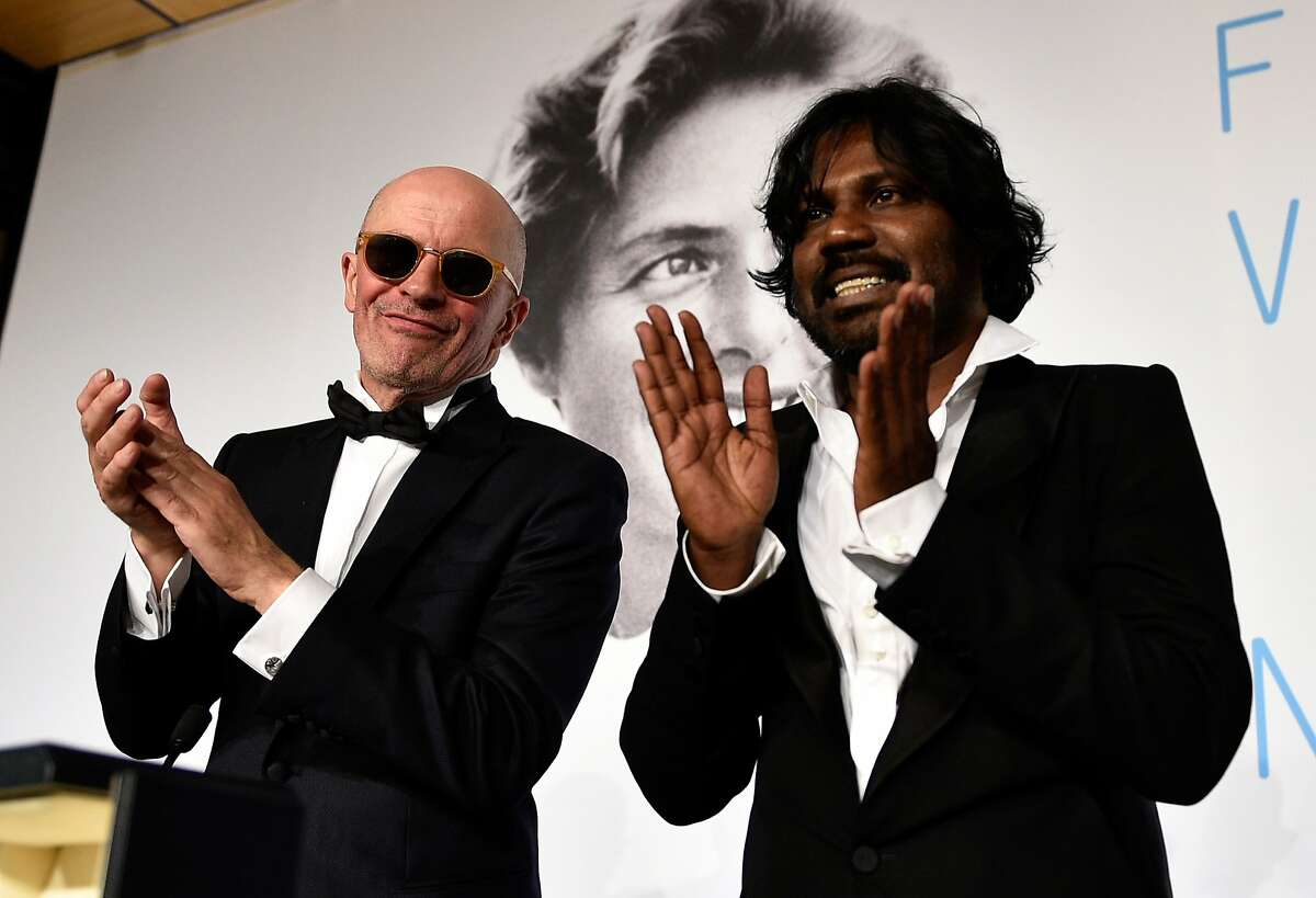 CANNES, FRANCE - MAY 24: (L-R) Director Jacques Audiard and actor Jesuthasan Antonythasan clap after winning the Palme d'Or won for 'Dheepan' during the Palme D'Or Winners press conference during the 68th annual Cannes Film Festival on May 24, 2015 in Cannes, France. (Photo by Pool/Getty Images)