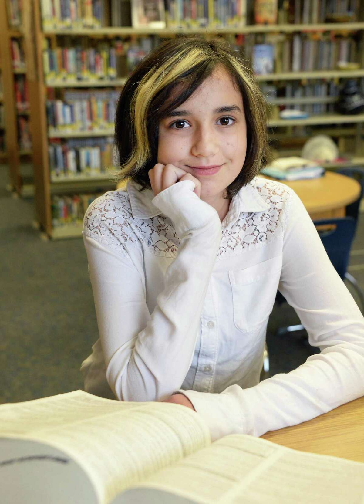 National spelling bee competitor Lydia Loverin, 13, in the library at New Lebanon Junior-Senior High School Friday April 24, 2015 in Ne w Lebanon, NY. (John Carl D'Annibale / Times Union)