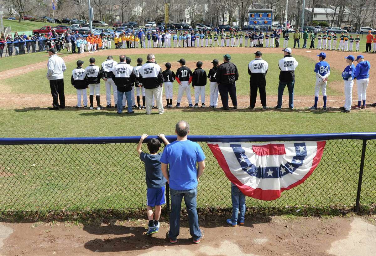 Pregame ceremonies during Stamford Little League's opening day at the Springdale baseball field. Youth sports leagues in the city are angry at a plan that would allow a soccer club from high-end sports complex Chelsea Piers Connecticut to rent sports fields.