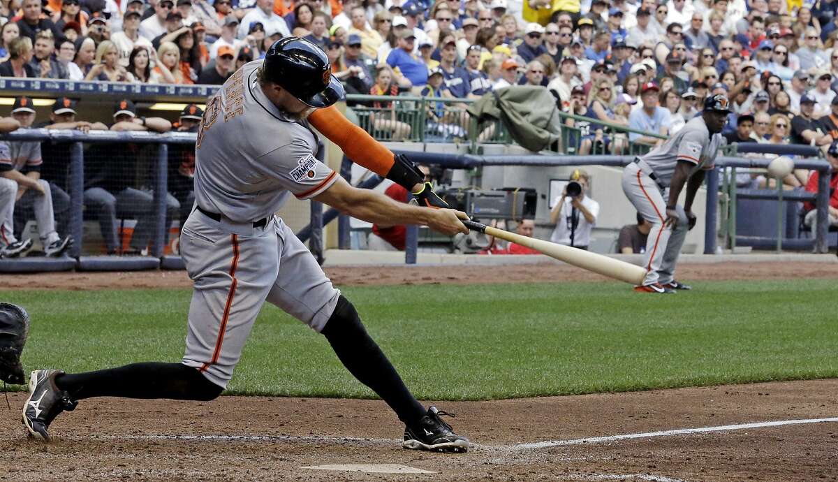 San Francisco Giants' Hunter Pence hits a two-run double during the sixth inning of a baseball game against the Milwaukee Brewers, Monday, May 25, 2015, in Milwaukee. (AP Photo/Morry Gash)